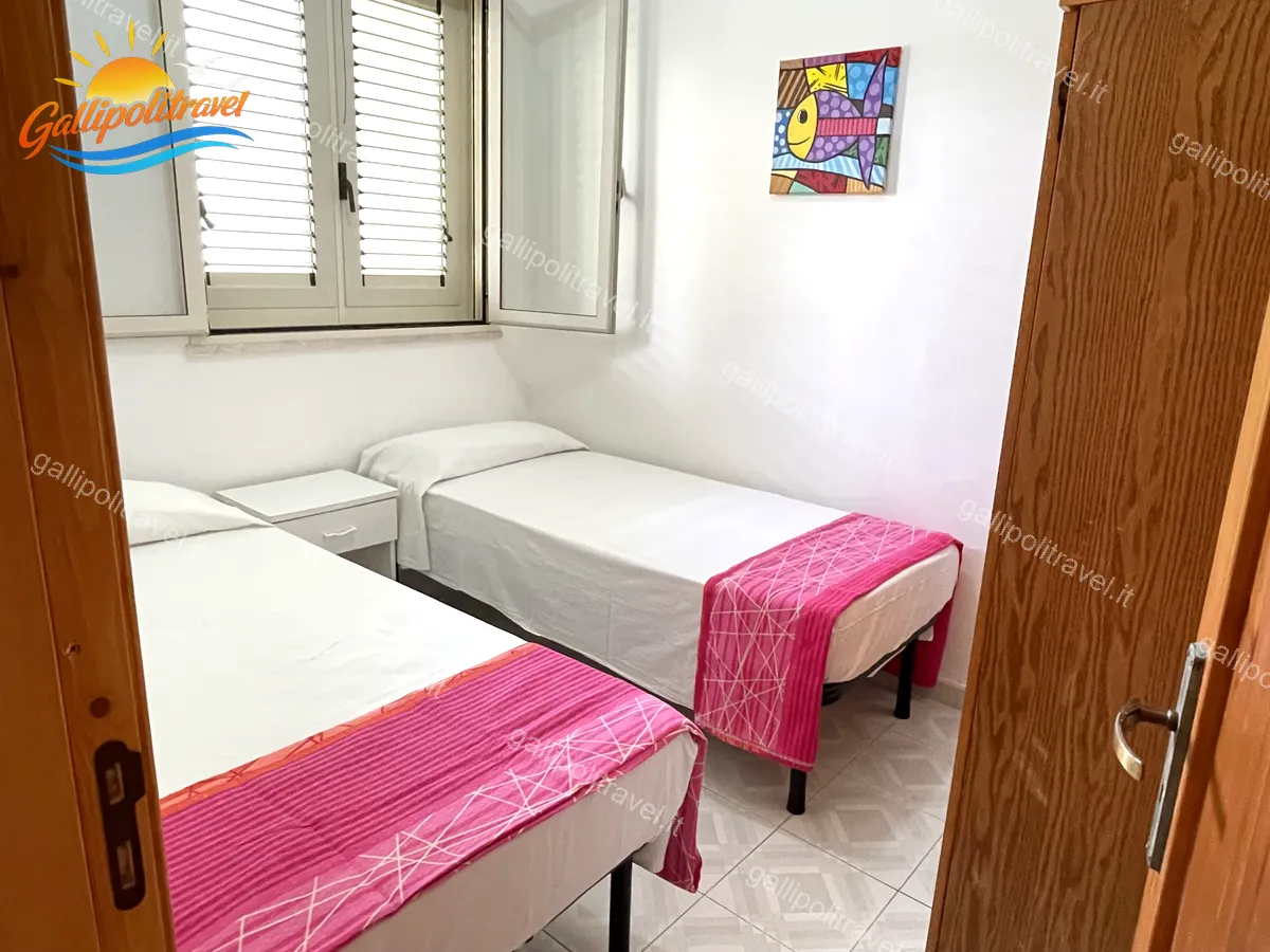 Chambre simple avec couverture écaillée du trois pièces Tamerici 03, Baia Verde Gallipoli